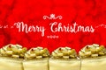 Merry Christmas word with many golden color present with red bokeh light background,Holiday Greeting card