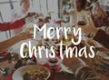 Merry Christmas word on people celebrating Royalty Free Stock Photo