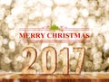 Merry Christmas 2017 word in perspective room with gold sparkling bokeh lights and wooden plank floor,leave space for display