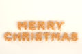 Merry Christmas words from orange balls on white background