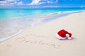 Merry Christmas written on beach white sand with Royalty Free Stock Photo