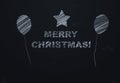 Merry christmas written black chalk table.