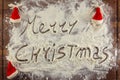 Merry christmas written with flour Royalty Free Stock Photo