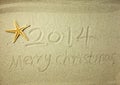 Merry Christmas written on tropical beach white sand Royalty Free Stock Photo