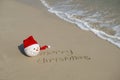 Merry Christmas written on tropical beach white sand Royalty Free Stock Photo