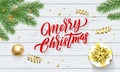 Merry Christmas, Xmas gold stars decoration. Vector Xmas tree ornaments and calligraphy lettering on wood Royalty Free Stock Photo