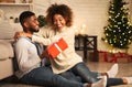 Merry Christmas. Young couple celebrating Christmas at home Royalty Free Stock Photo