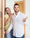 Merry couple coming to the apartment Royalty Free Stock Photo