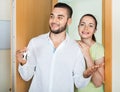 Merry couple coming to the apartment Royalty Free Stock Photo