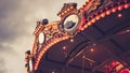 Merry-Go-Round carousel illuminated at night.reflection cityscape against evening sky in summer .festival happy time idea Royalty Free Stock Photo