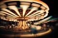 Merry-go-round carousel at night, motion blur