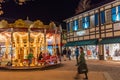 Merry go round in Designer Outlet Roermond with christmas decorations during night time. Royalty Free Stock Photo