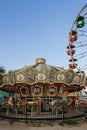 A Merry-go-round with horses and cheetahs with colorful lights and carnival rides along the boardwalk Royalty Free Stock Photo