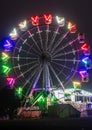 merry go round swing at night with colorful light at city fair ground from different angle Royalty Free Stock Photo