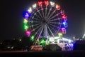 merry go round swing at night with colorful light at city fair ground from different angle Royalty Free Stock Photo