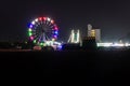 merry go round swing at night with colorful light at city fair ground from different angle Royalty Free Stock Photo