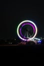 merry go round swing at night with colorful light at city fair ground and long exposure motion burr Royalty Free Stock Photo