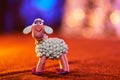 Merry plasticine sheep from the Christmas series and blurred lights