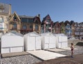 Beach cabins and colorful houses of mers les bains in french normandy