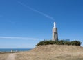 Tourists visit statue notre dame de la falaise near mers les bains