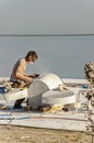 Mersin, Mezitli / Turkey - 11 15 2010: Unknown sculptor carves sculpture from white marble with grinding tool.