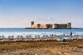 Mersin, Turkey - August 16, 2019: Maiden`s castle, Kiz Kalesi with deckchairs in Mediterranean Sea. Mersin Turkey Royalty Free Stock Photo