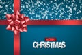 Mery Christmas banner. Xmas and Happy New Year realistic design concept. Red ribbon and bow covered with snow on blue background. Royalty Free Stock Photo