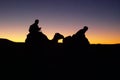 Silhouette of camel riders at Moroccan desert