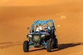 Merzouga, Morocco - Feb 22, 2016: Blue Polaris RZR 800 and pilot