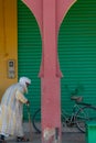 Merzouga. Morocco. October 3, 2019. Arab man with walking stick in front of a building