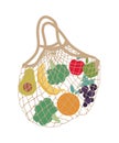 Mesh eco bag full of fruit and vegetables (grape, orange, apple, banana, broccoli, avocado). Royalty Free Stock Photo