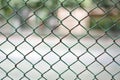 Mesh fence panel on blurred Background. Royalty Free Stock Photo