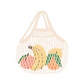 Mesh or net bag full of fruits isolated on white background. Modern shopper with fresh organic bananas, peaches, oranges Royalty Free Stock Photo