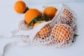 Mesh shopping beg with oranges - nature friendly style