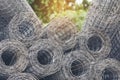 Mesh wire rolls of iron stainless steel, galvanized metal sheets construction material. Chicken wire mesh rolls farm fence. Net Royalty Free Stock Photo