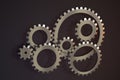 Meshing mechanical gears, metallic parts, 3d rendering