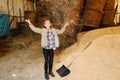 Mesmerised ginger girl throwing wood shavings up and watching them fall Royalty Free Stock Photo