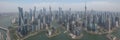 A mesmerising view of the skyscrapers of Shanghai, China, from the Wangpu River. High-rise buildings and bridges are reflected in Royalty Free Stock Photo