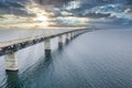 Mesmerizing aerial view of the bridge between Denmark and Sweden under the cloudy sky