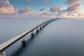 Mesmerizing aerial view of the bridge between Denmark and Sweden under the cloudy sky