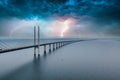 Mesmerizing aerial view of the bridge between Denmark and Sweden under the sky with lightning