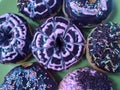 Delightful donuts with chocolate and pink glazes in the shape of flowers