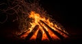 A mesmerizing campfire ablaze in the darkness of the night Royalty Free Stock Photo