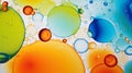 Mesmerizing colorful oil stains and vibrant bubbles as dynamic abstract background, top view