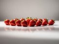 A mesmerizing display of ripe strawberries arranged in a studio setting.