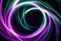 A mesmerizing fractal pattern resembling endless spirals, glowing in neon green and purple, creating