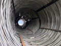 A mesmerizing interior view of a large, spiraling metallic wire mesh coil. Royalty Free Stock Photo