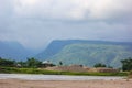 Mesmerizing landscape. River, mountain, home, cloud all together in Sunamganj, Bangladesh Royalty Free Stock Photo