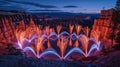 Mesmerizing Nighttime Light Display Amidst Stunning Rock Formations in Vibrant Desert Landscape Featuring Illuminated Patterns and Royalty Free Stock Photo