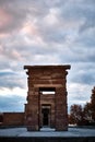 Mesmerizing scene of a rocky gate of the Temple of Debod in Madrid, Spain against a cloudy gray sky